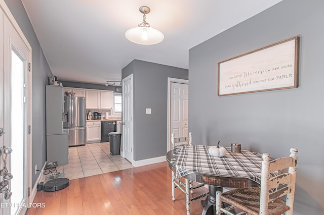 dining area with light hardwood / wood-style flooring