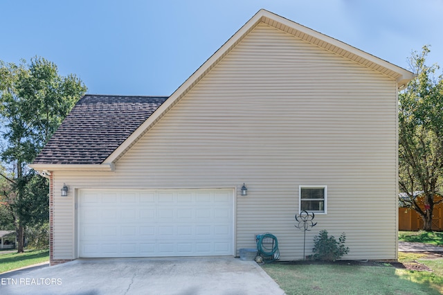 view of side of property featuring a garage