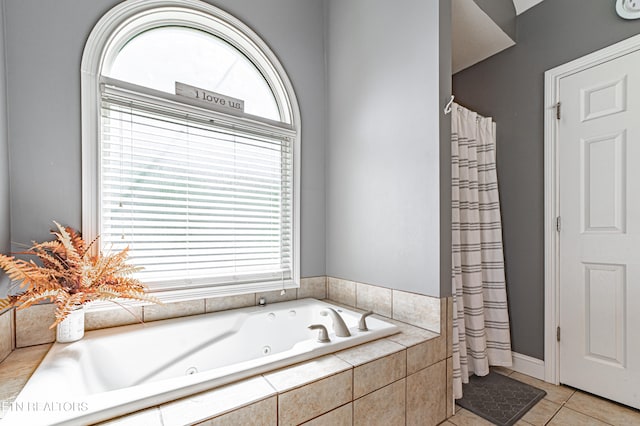 bathroom featuring independent shower and bath and tile patterned flooring