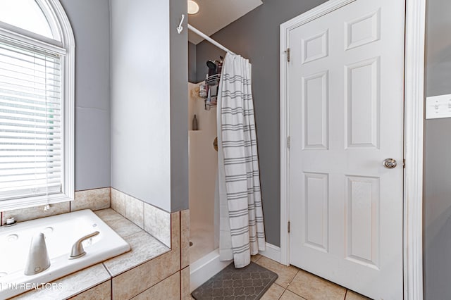 bathroom featuring tile patterned floors and independent shower and bath