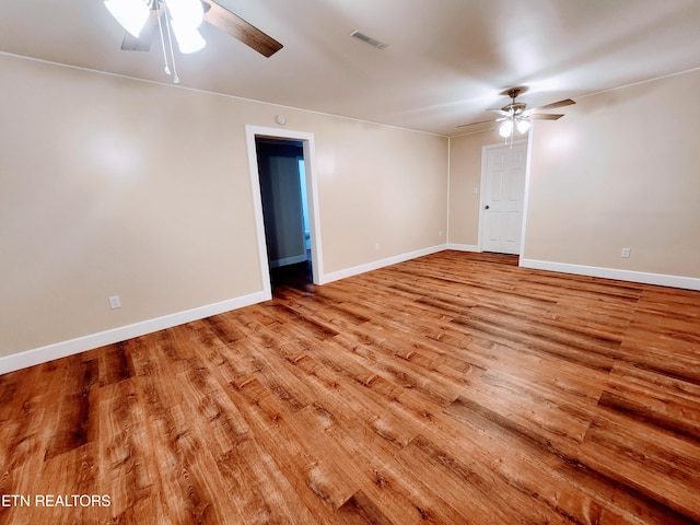 spare room with ceiling fan and light hardwood / wood-style flooring