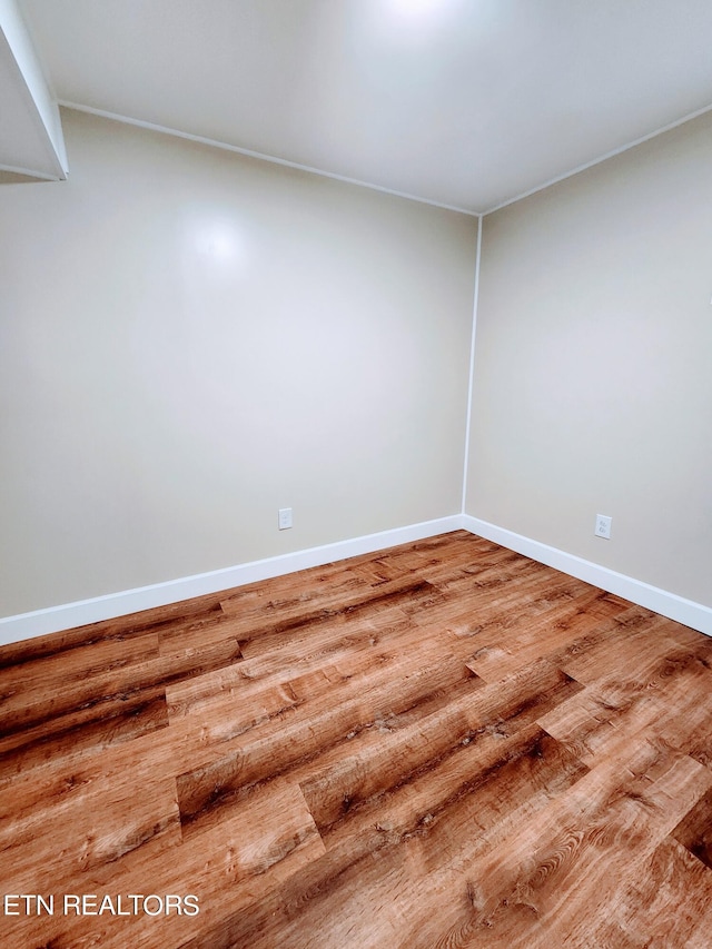 unfurnished room featuring wood-type flooring