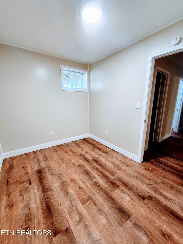 empty room with wood-type flooring