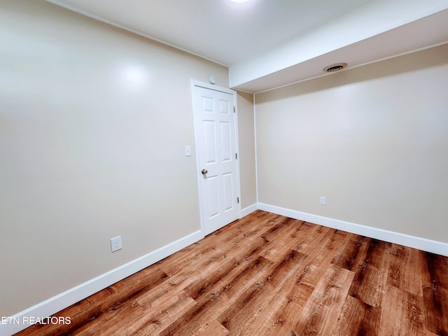 unfurnished room featuring hardwood / wood-style flooring