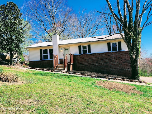 ranch-style house with a front lawn