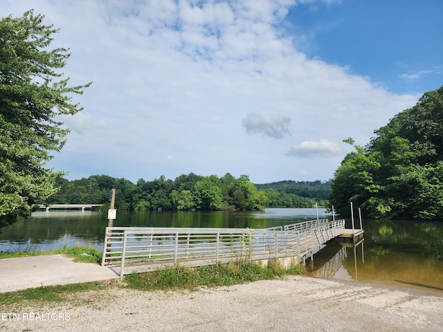 view of dock with a water view