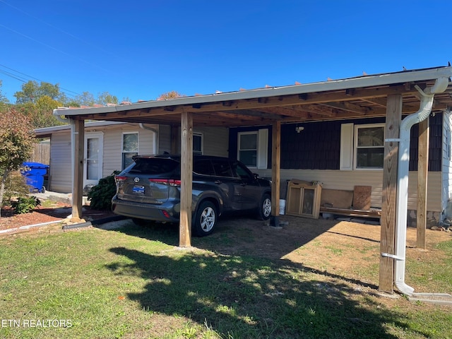 exterior space featuring a carport and a lawn