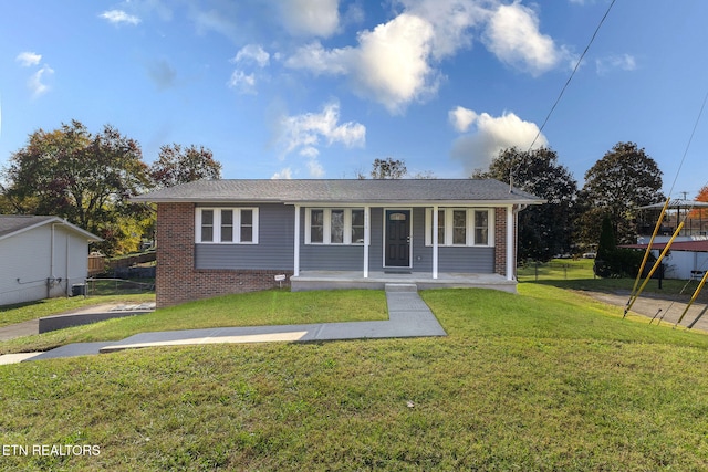 view of front of house featuring covered porch and a front lawn