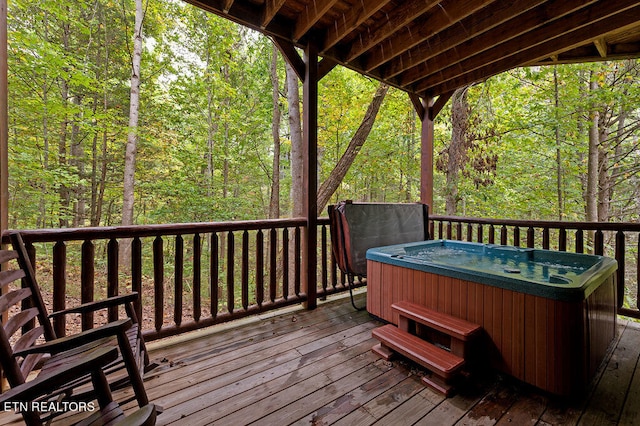 deck featuring a hot tub