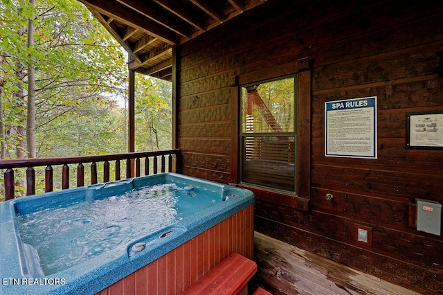 deck with a hot tub