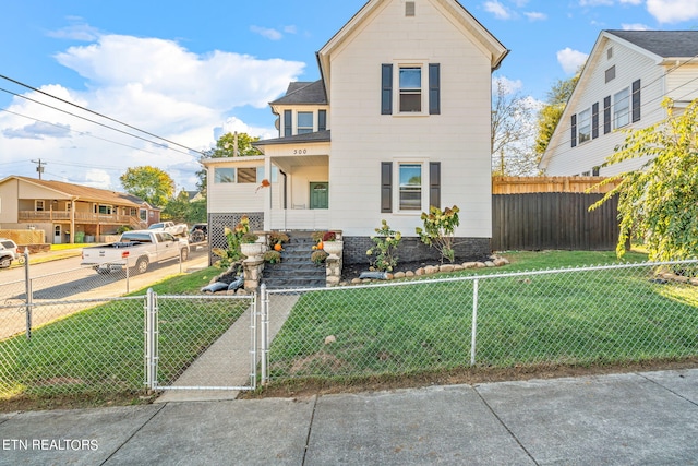 view of front of home featuring a front lawn