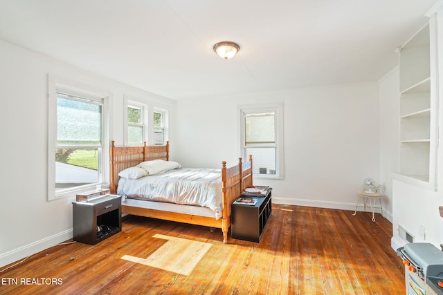 bedroom featuring dark wood-type flooring