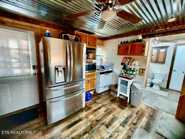 kitchen featuring dark hardwood / wood-style floors, appliances with stainless steel finishes, and ceiling fan