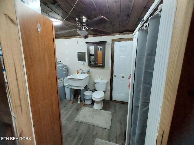 bathroom featuring ceiling fan, wood ceiling, hardwood / wood-style floors, and toilet