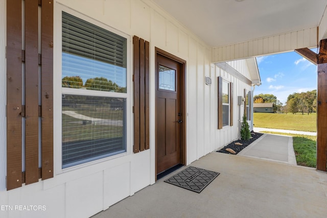 property entrance with a patio area