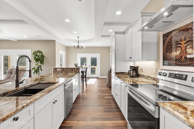 kitchen featuring sink, french doors, white cabinetry, appliances with stainless steel finishes, and dark hardwood / wood-style floors