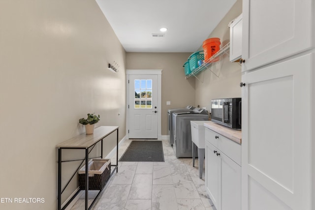 laundry area featuring separate washer and dryer