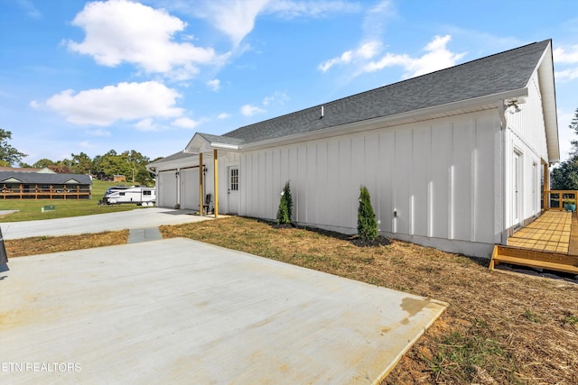 view of side of property featuring a garage