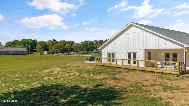 exterior space featuring a yard and a wooden deck