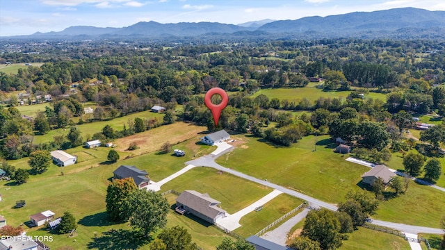 birds eye view of property with a mountain view