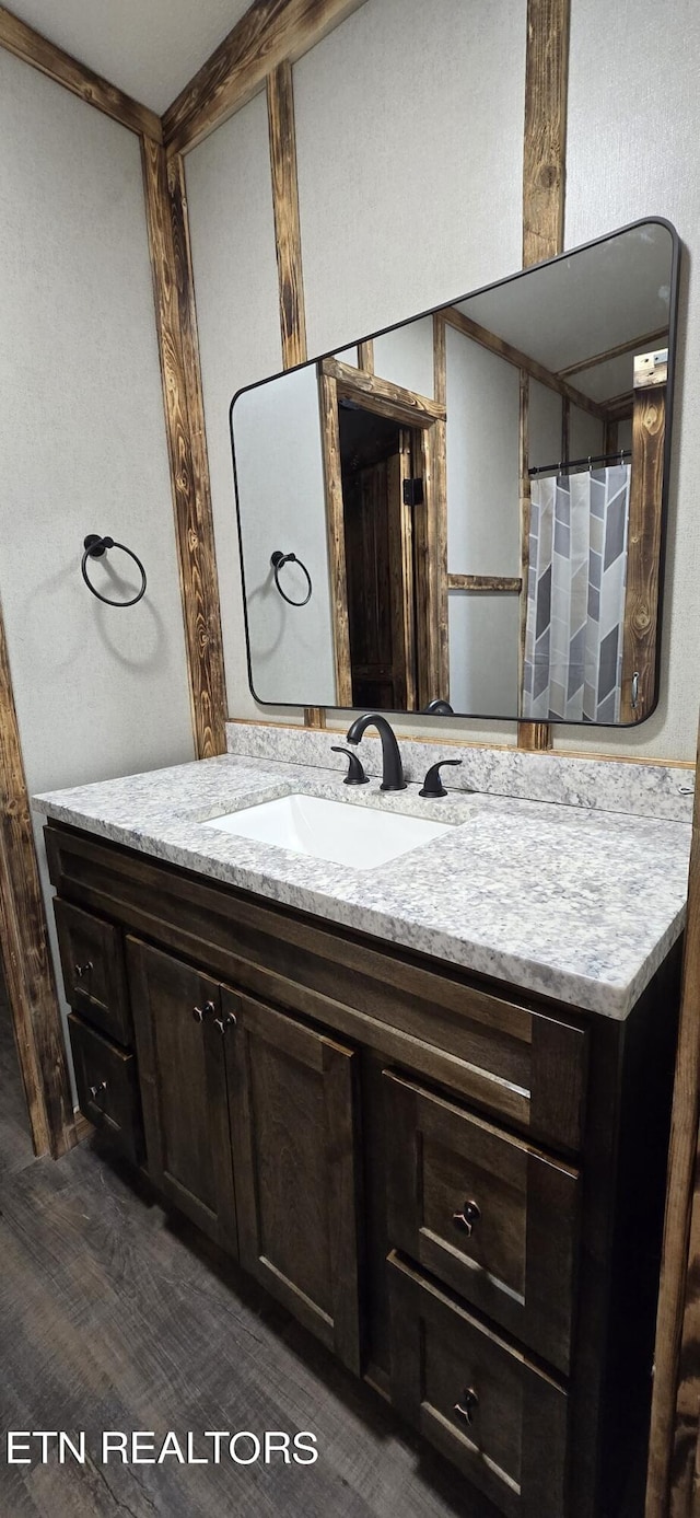 bathroom featuring vanity and wood-type flooring