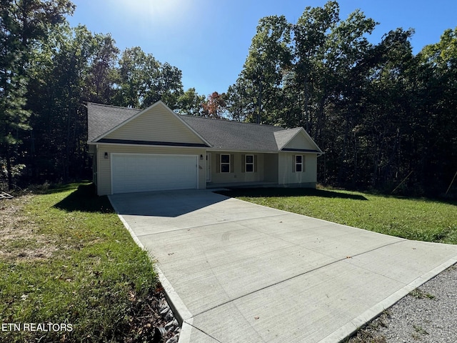 ranch-style home with a front yard and a garage