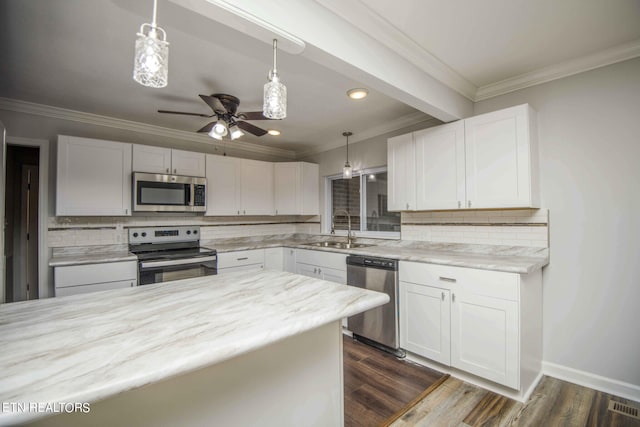 kitchen featuring stainless steel appliances and white cabinetry