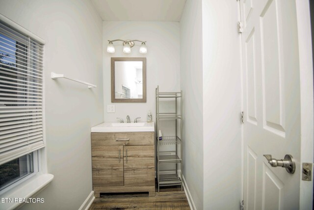 bathroom featuring vanity and hardwood / wood-style flooring