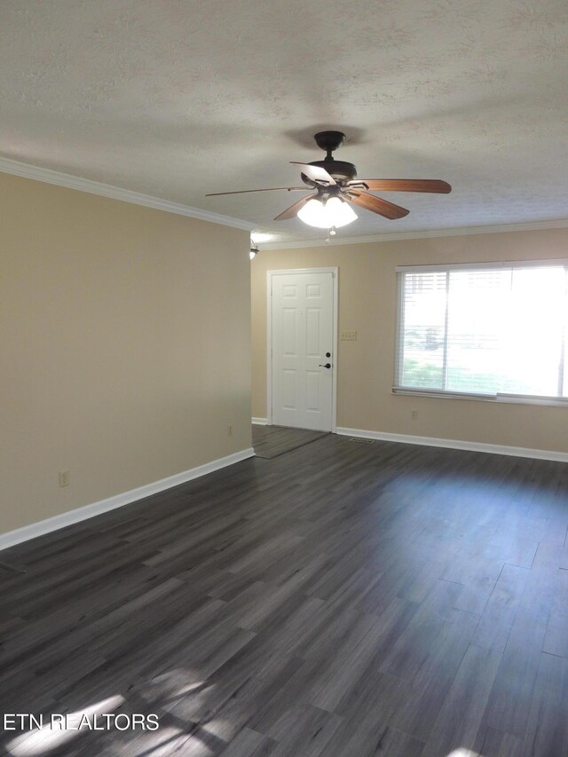 1432 Pheasants Glen Dr, Knoxville, TN 37923 - unfurnished living room with a textured ceiling, ornamental molding, dark wood-style flooring, a ceiling fan, and baseboards