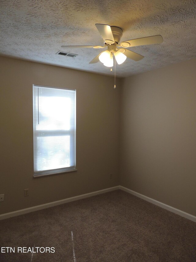 1432 Pheasants Glen Dr, Knoxville, TN 37923 - spare room with a ceiling fan, carpet floors, baseboards, and a textured ceiling