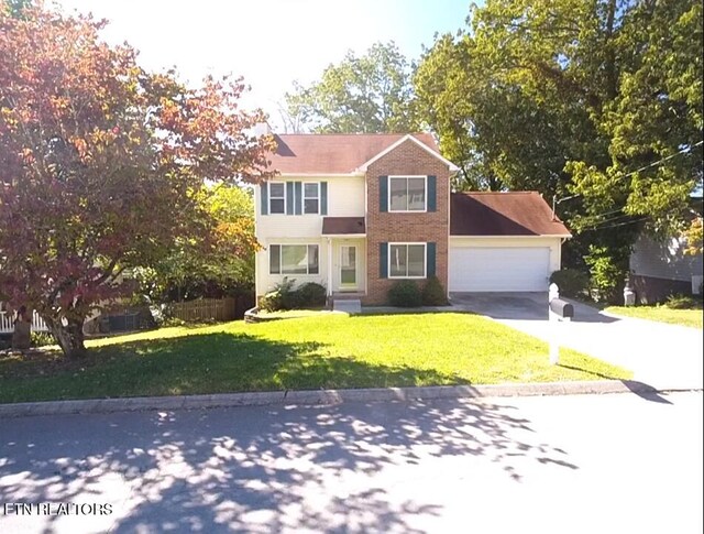 1432 Pheasants Glen Dr, Knoxville, TN 37923 - traditional-style home featuring concrete driveway, a front yard, and an attached garage