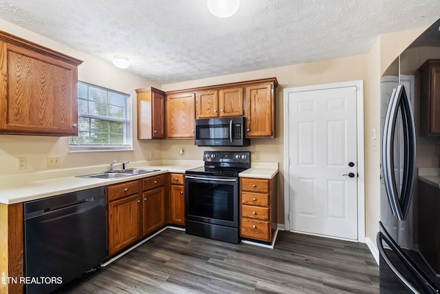 1432 Pheasants Glen Dr, Knoxville, TN 37923 - kitchen with freestanding refrigerator, dark wood-style flooring, black dishwasher, a sink, and electric range
