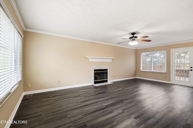 1432 Pheasants Glen Dr, Knoxville, TN 37923 - unfurnished living room featuring a tile fireplace, baseboards, ceiling fan, and dark wood-style floors