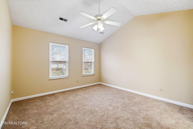 1432 Pheasants Glen Dr, Knoxville, TN 37923 - carpeted spare room featuring vaulted ceiling, visible vents, baseboards, and a ceiling fan