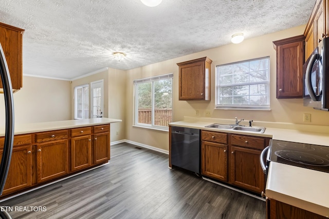 1432 Pheasants Glen Dr, Knoxville, TN 37923 - kitchen featuring a sink, brown cabinets, dark wood-style flooring, light countertops, and appliances with stainless steel finishes