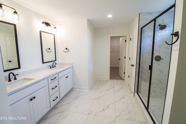 bathroom featuring walk in shower and vanity