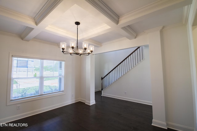 empty room featuring dark wood finished floors, beam ceiling, a chandelier, ornamental molding, and coffered ceiling