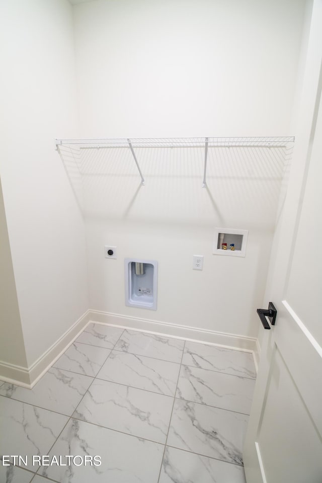laundry area featuring laundry area, hookup for a washing machine, marble finish floor, baseboards, and electric dryer hookup