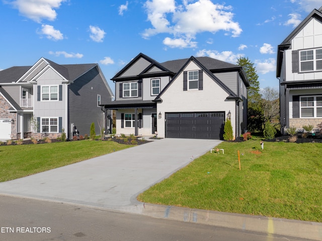 view of front of property with a garage and a front lawn