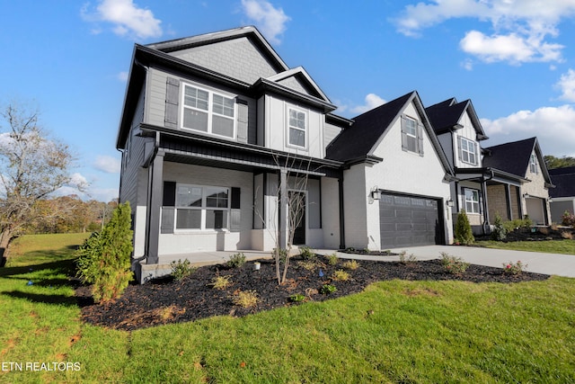 view of front facade featuring a garage and a front lawn