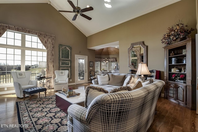 living area with a wealth of natural light, wood finished floors, and ornamental molding