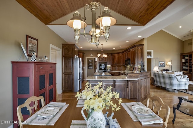 dining space with a chandelier, wood ceiling, recessed lighting, wood finished floors, and high vaulted ceiling