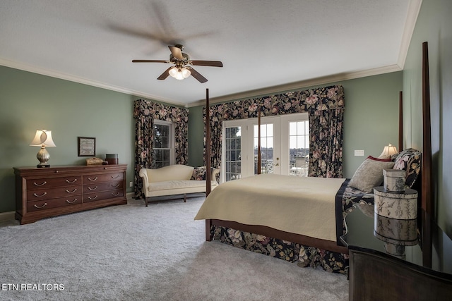 carpeted bedroom featuring access to exterior, crown molding, french doors, and ceiling fan