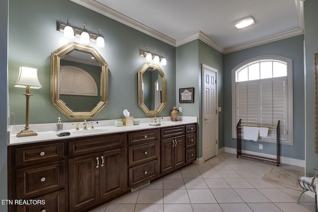 full bath featuring tile patterned flooring, double vanity, crown molding, and a sink