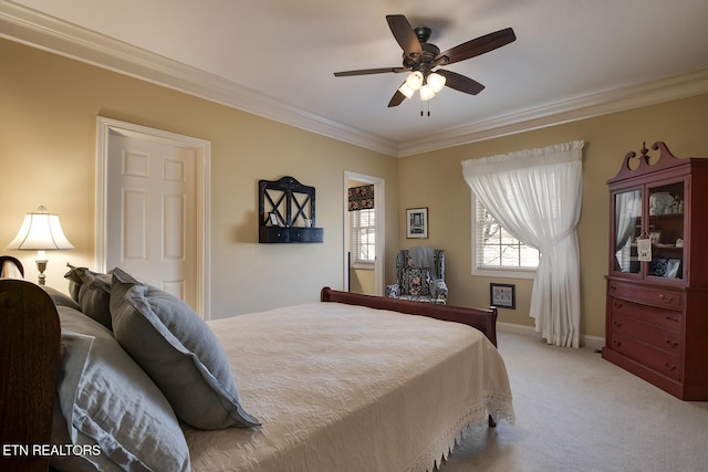 bedroom featuring crown molding, a ceiling fan, baseboards, and light carpet