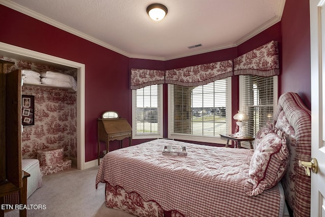 carpeted bedroom featuring visible vents, crown molding, and baseboards