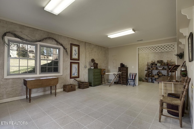 interior space featuring crown molding and baseboards