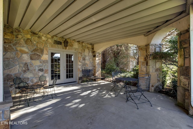 view of patio featuring french doors and outdoor dining area