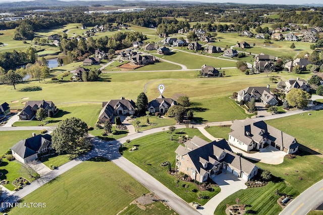 birds eye view of property featuring a residential view and golf course view