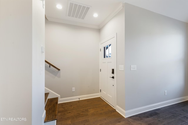 entrance foyer with dark hardwood / wood-style floors and crown molding